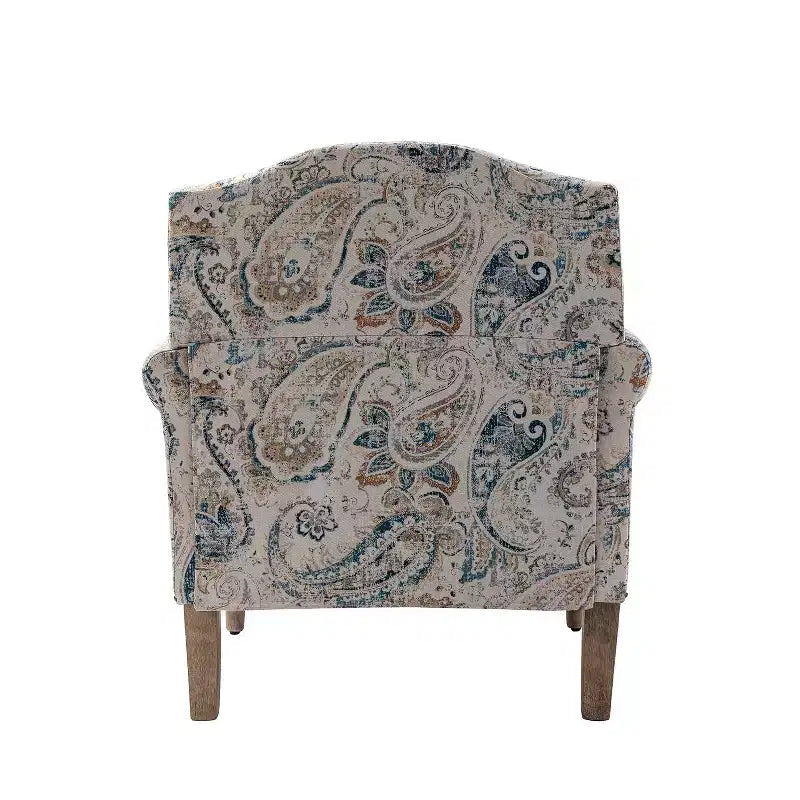 Fauteuil rembourré en bois avec motif floral, accoudoirs à panneaux et dossier en forme de bosse de chameau.
