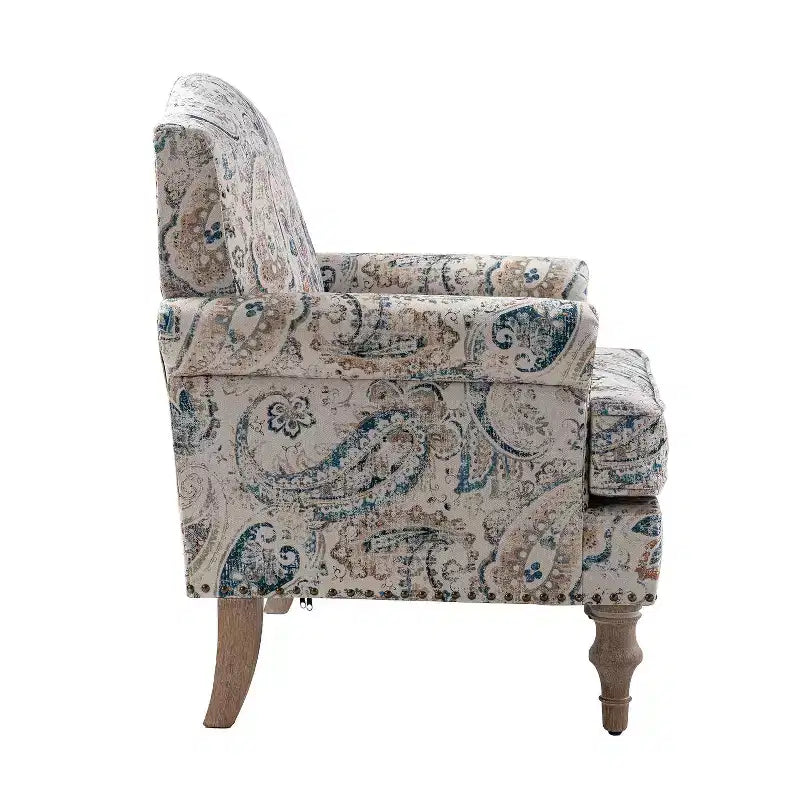 Fauteuil rembourré en bois avec motif floral, accoudoirs à panneaux et dossier en forme de bosse de chameau.